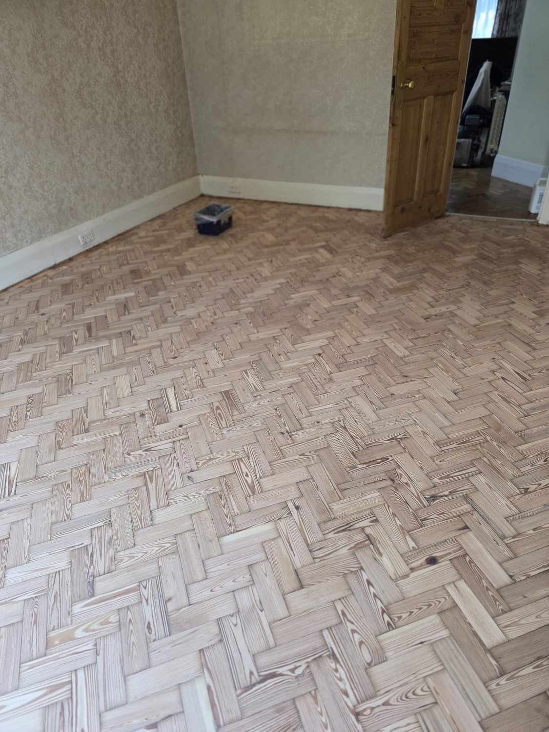 Close-up of restored pitch pine parquet flooring in Brixton