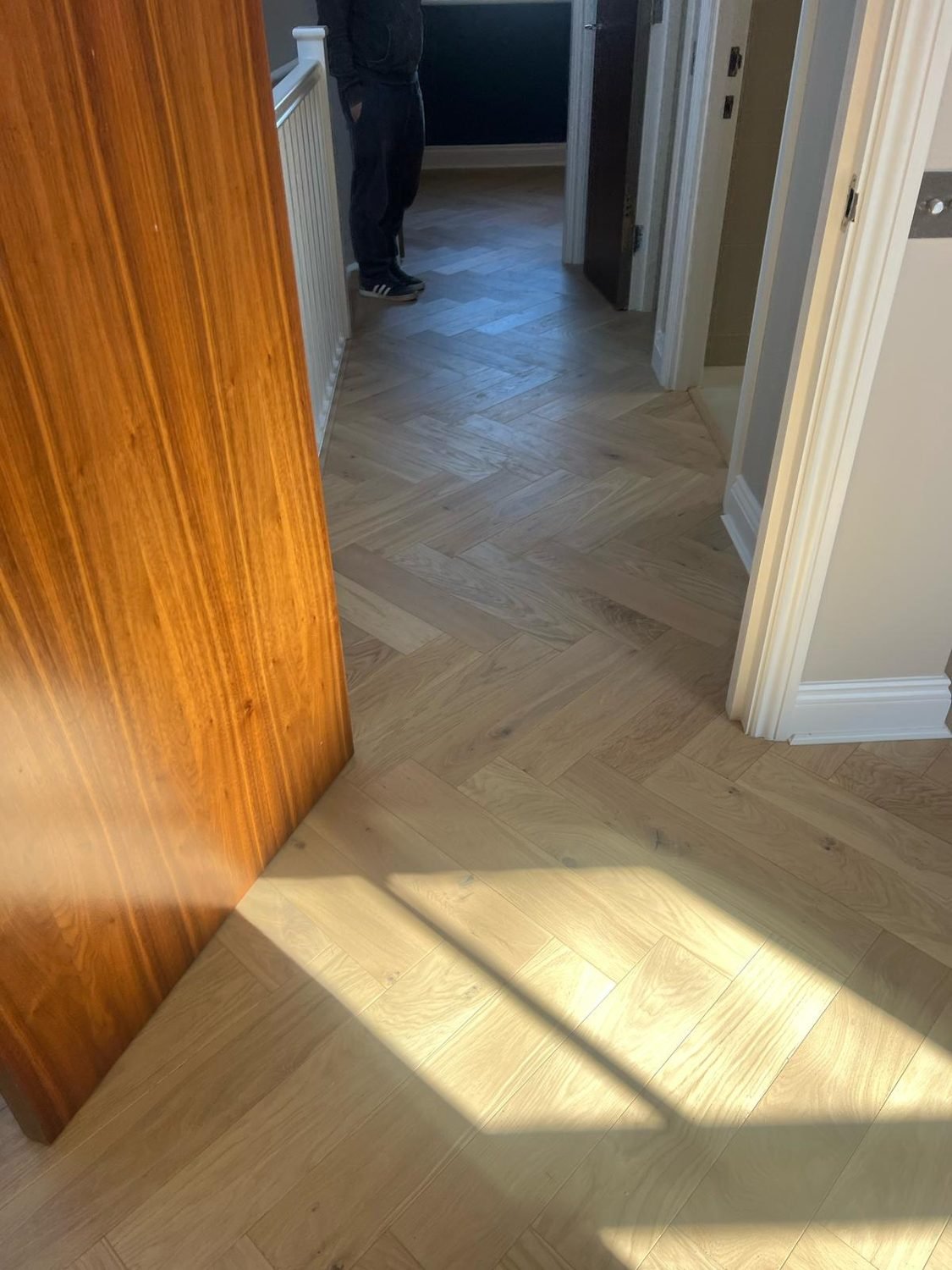 Herringbone floor on a landing in a Hackney property