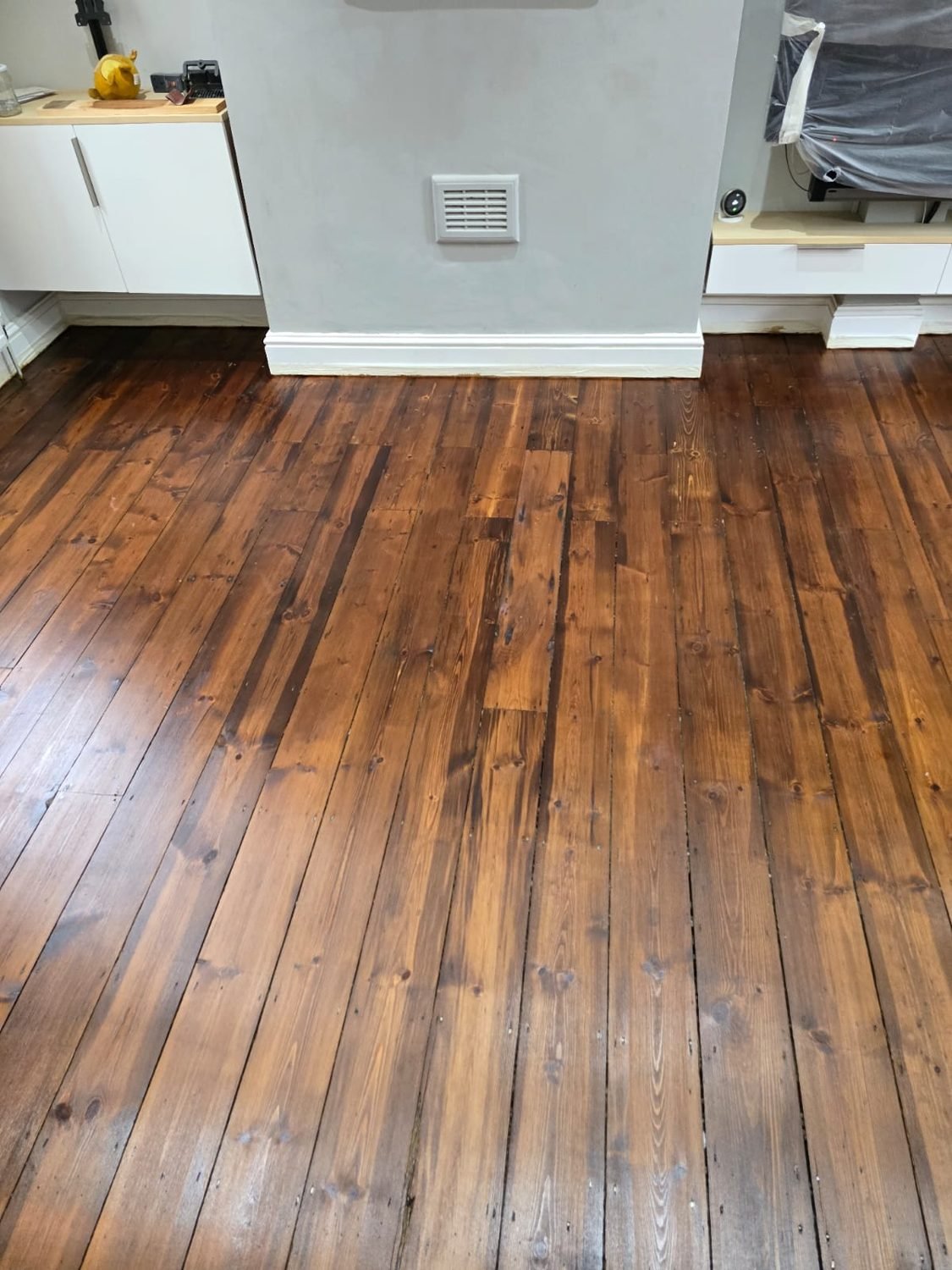 Pine floor boards restoration project and concrete hearth restitch in Wandsworth
