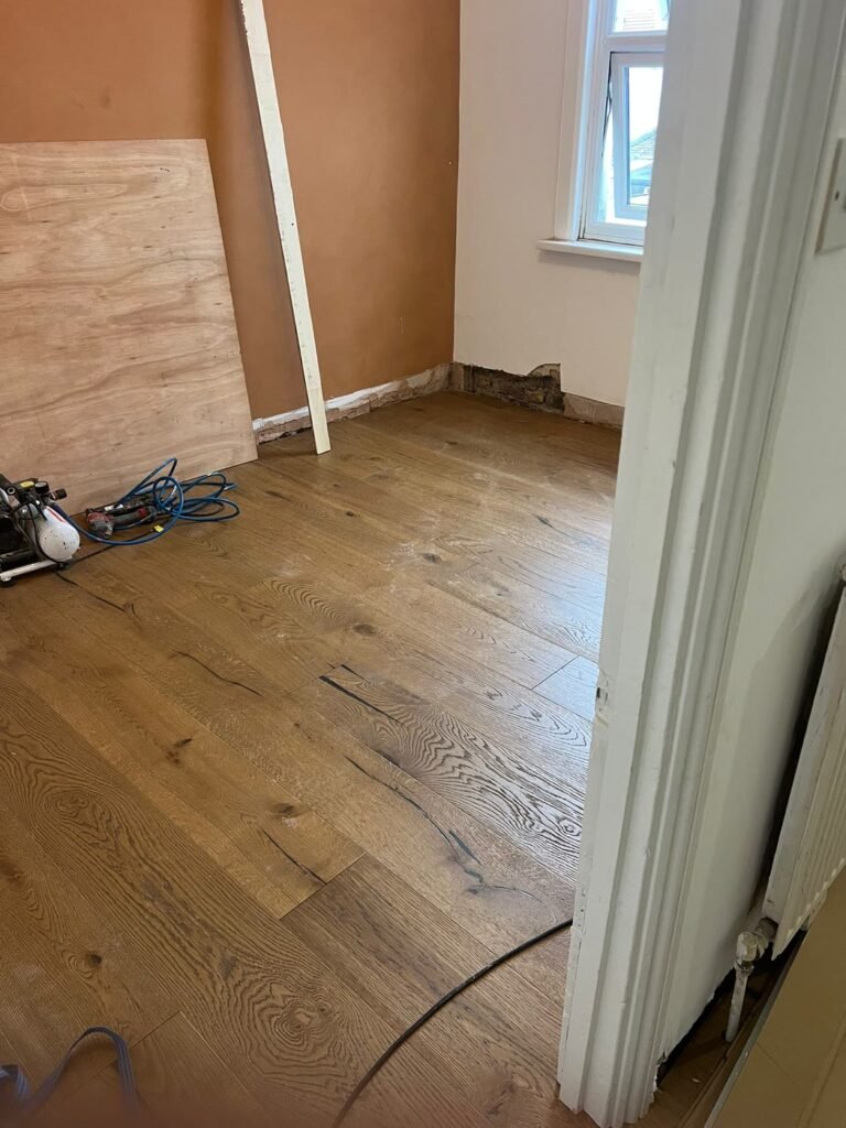 New engineered wood floor glued down in East London E7