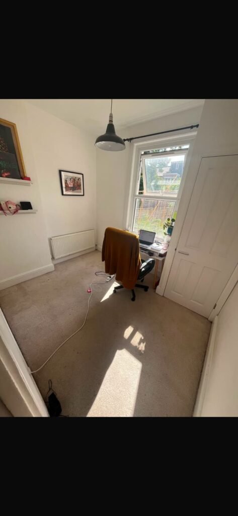 Bedroom with old carpet before removal in North London N4